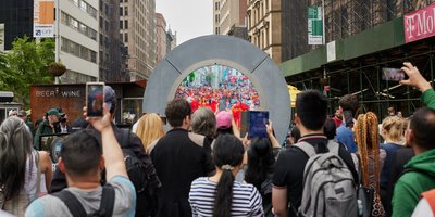 View from behind crowds gathered at The Portal