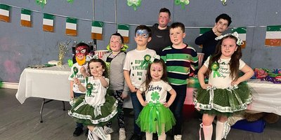 Group of children in St Patrick's Day costumes.