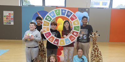 A group of primary school children in a school gym.