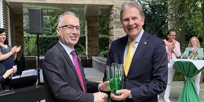 Ambassador presenting his award