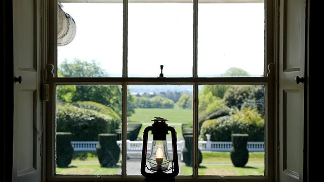 old oil lamp in a window