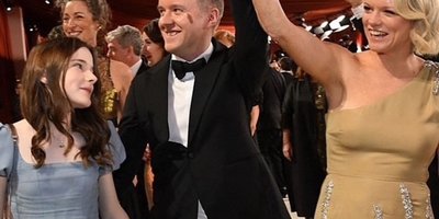 Cleona Ní Chrualaoi, producer of the Oscar nominated "An Cailín Ciúin", and its star, Catherine Clinch wearing custom Caterina Coyne at the Academy Awards