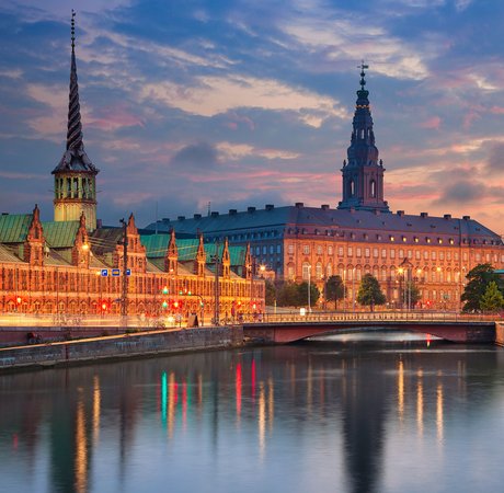 View of skyline of Copenhagen at dusk.