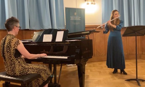 Elaine Loebenstein playing the piano and Miriam Kaczor playing the flute together