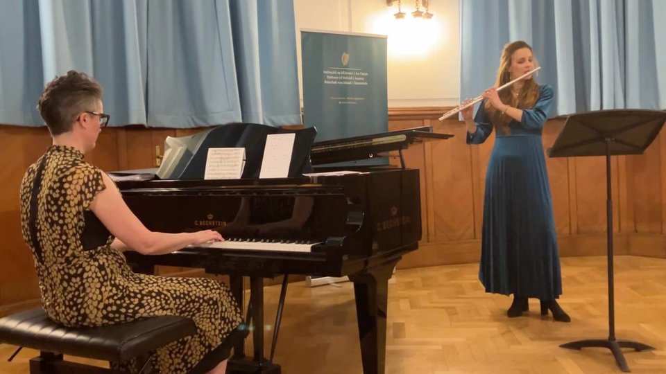 Elaine Loebenstein playing the piano and Miriam Kaczor playing the flute together