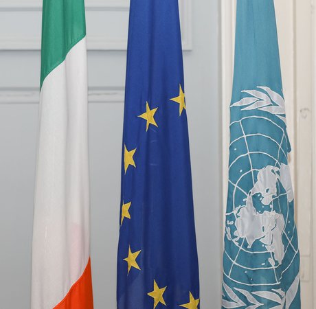 Irish, EU and UN flags.