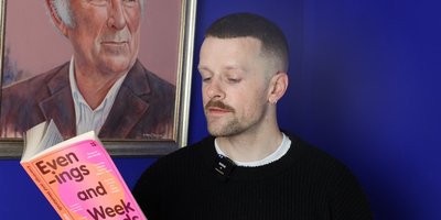 headshot of Oisín McKenna reading from his book Evenings and Weekends