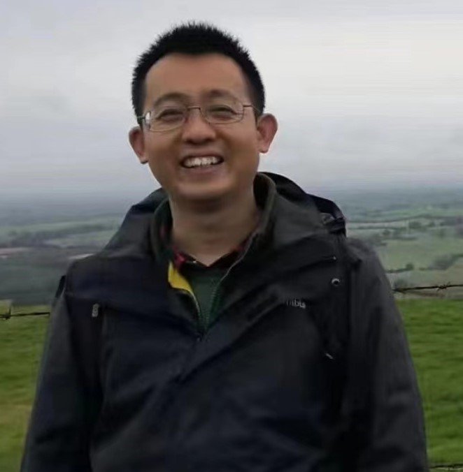 Picture of a Chinese Irish language and history teacher with grassland in the background.