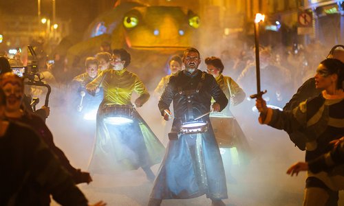 parade at night with drummers and lights