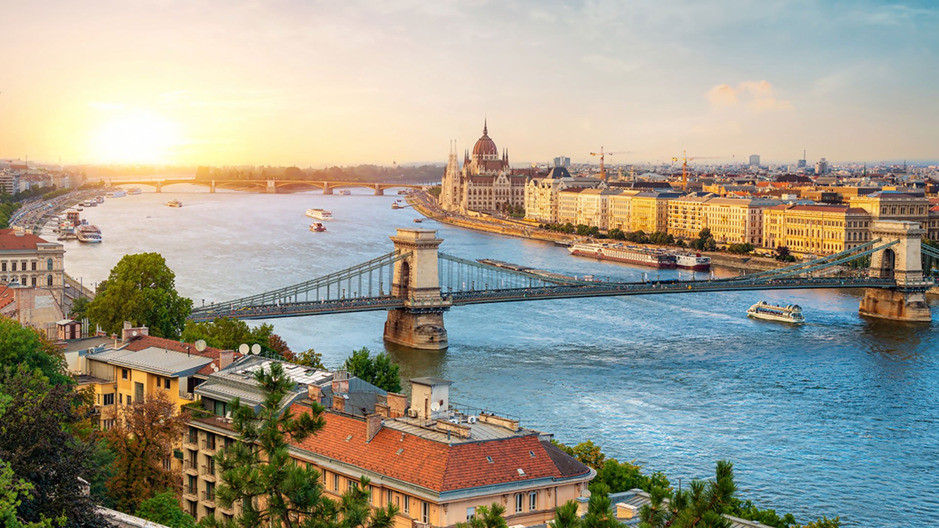 View of Budapest skyline down the river at sunrise.