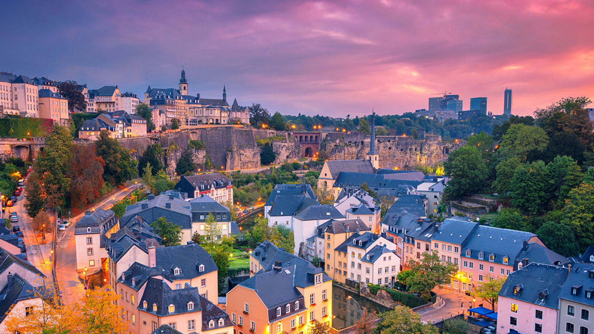 City in Luxembourg at dusk with a pink cloudy sky