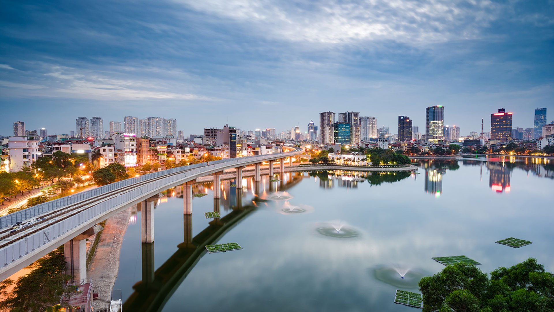 View of Hanoi's skyline across the bridge at dusk