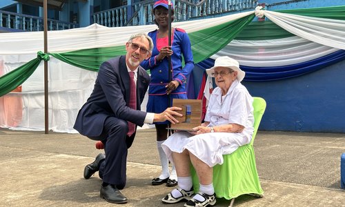 Woman sitting with a baby on her lap
