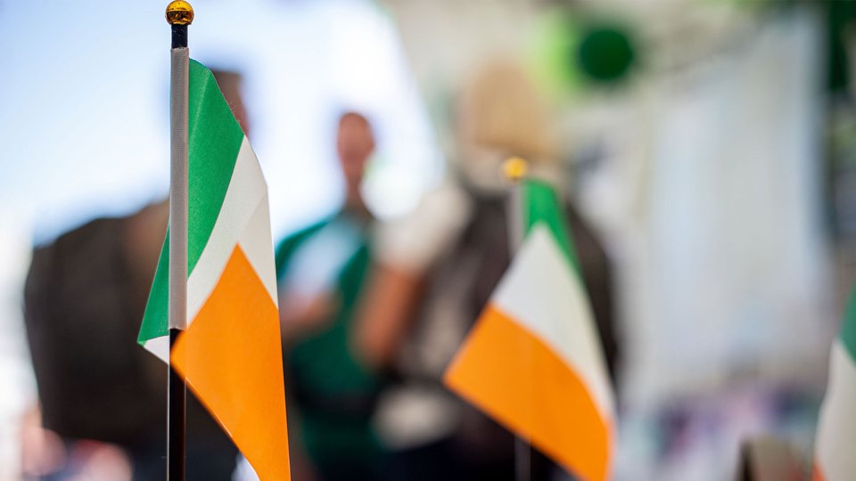 Map of the world with outlines of people overlaid.