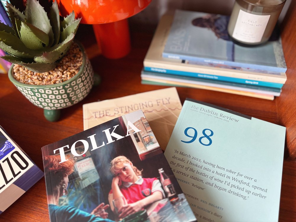 Irish literary journals Tolka, The Dublin Review, and The Stinging Fly on a shelf