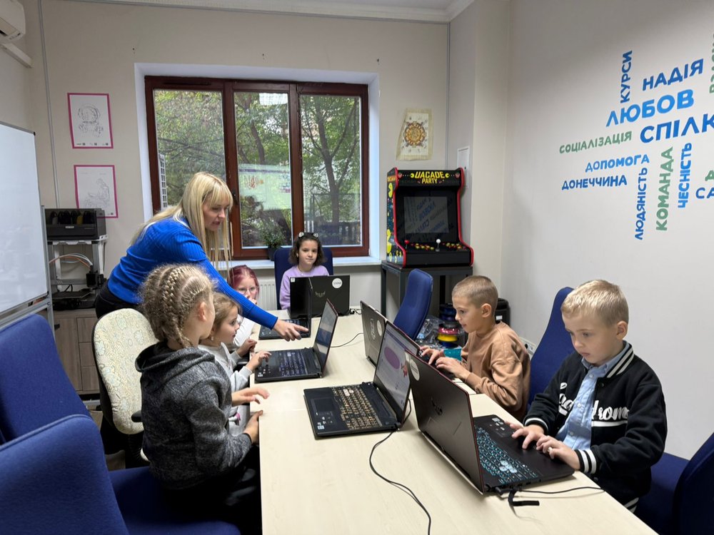 Children receiving IT skills classes supported by Irish Aid.