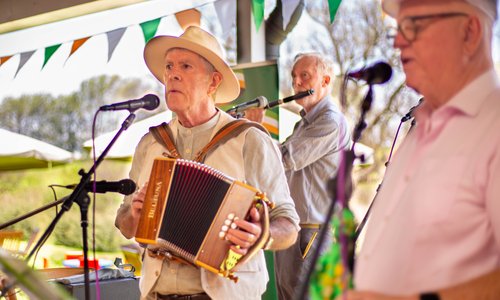 People singing and playing traditional Irish music