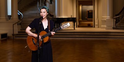 Lisa Hannigan playing the guitar