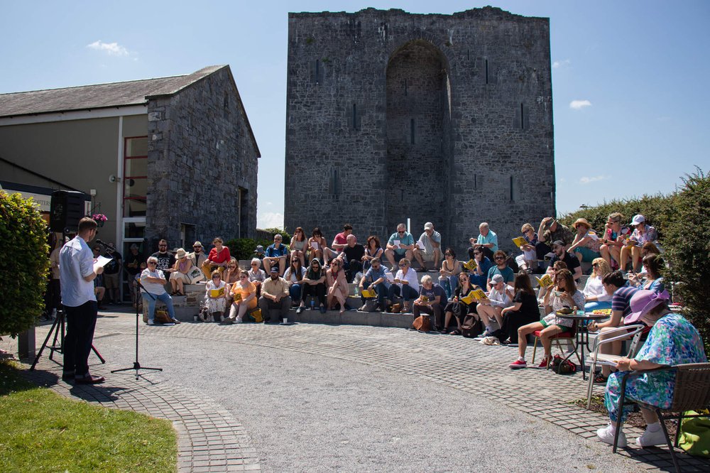 An audience gathered outside at Listowel Writers Week