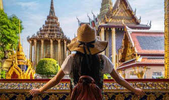 Tourist in Bangkok grand palace looking out at the views of Bangkok city