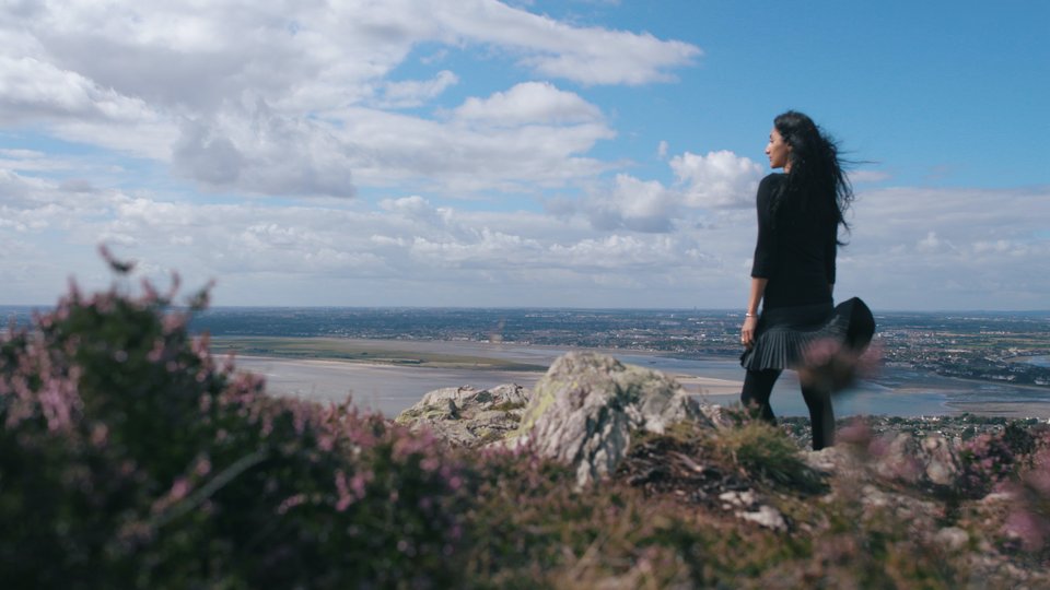 Nidhi Zak Aria Eipe staring out at the sea