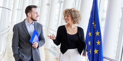 two people walking and talking