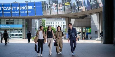 people walking along in an urban environment