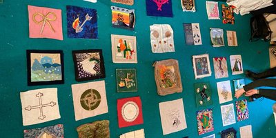 patches on the floor before sewn together for a quilt