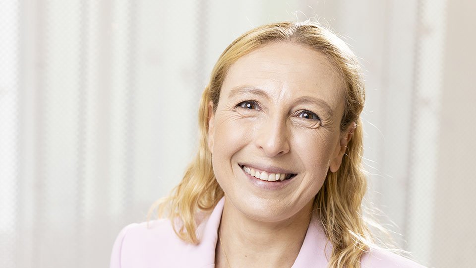 woman's face smiling at camera