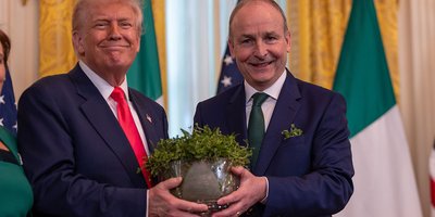 Taoiseach Micheál Martin handing Donald Trump a bowl of shamrock