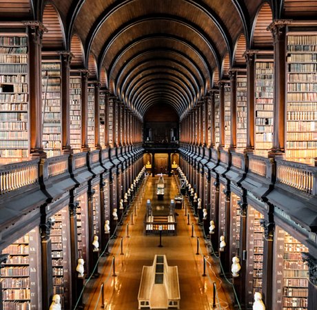 Trinity Long Hall with columns of books and an arched ceiling