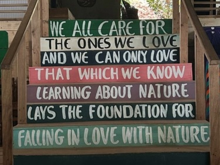 The steps in the learning centre that reads "We all care for the ones we love, and we can only love that which we know. Learning about nature lays the foundation for falling in love with nature."