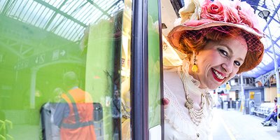 woman on dart in costume from just over 100 years ago