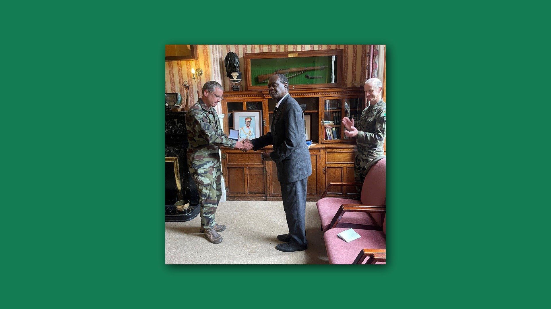 Lt. General Mumbi greeting a man in military uniform