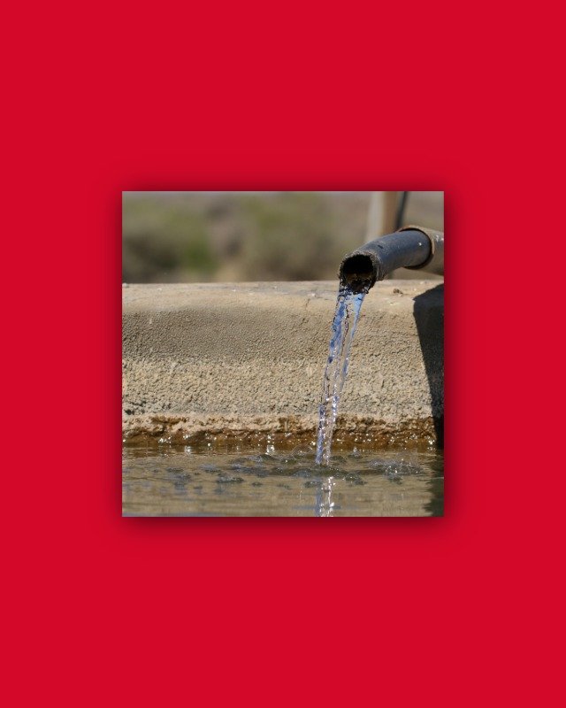 The tap of a water pump producing clear water