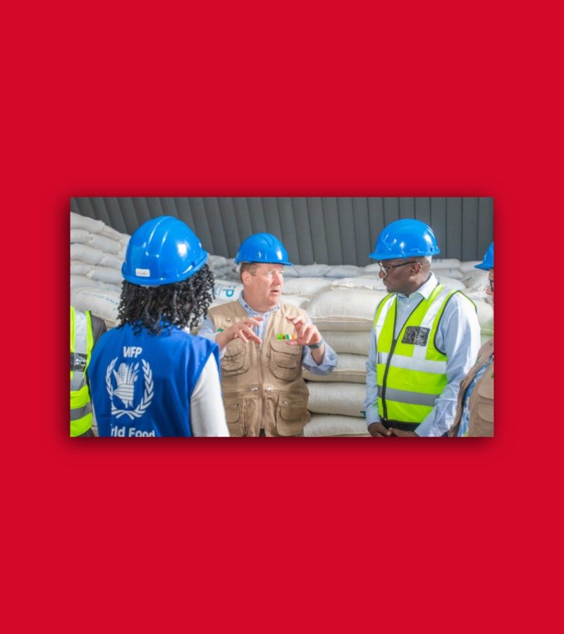 people in hard hats having a discussion