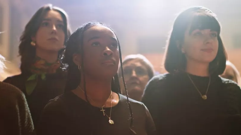 women's faces in a choir
