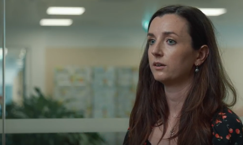 woman talking to camera in an office