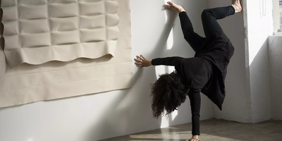 three women waiting for a train at the side of the track
