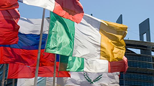 different country flags blowing in the wind