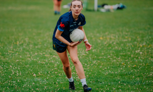 Woman playing Gaelic football