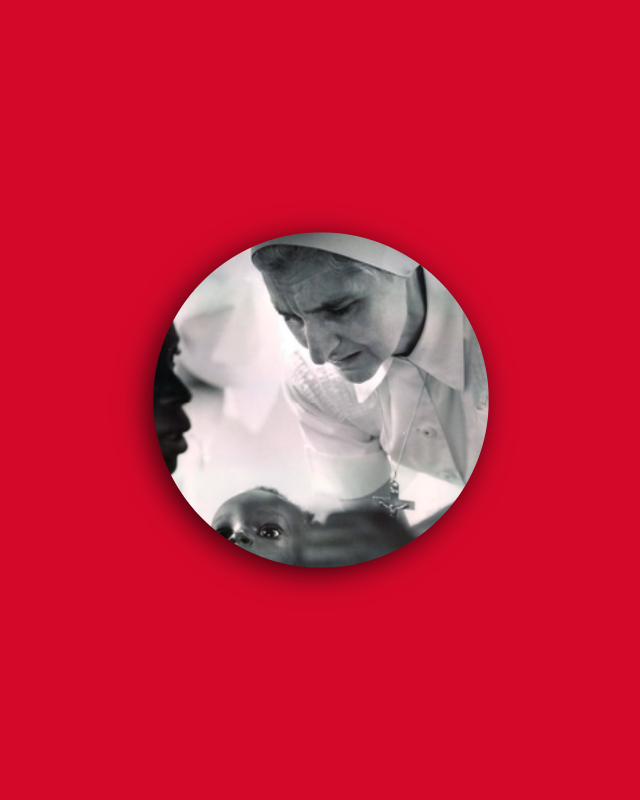 Sr Mona Tyndall looking at a baby in its mother's arms